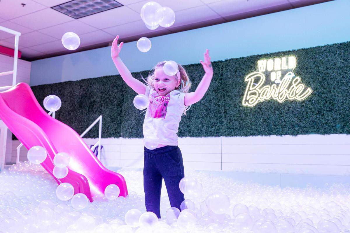 Tatum Callis, 4, plays in the ball pit at the ‘World of Barbie’ immersive experience at the Stonebriar Centre in Frisco on Thursday, Nov. 16, 2023.