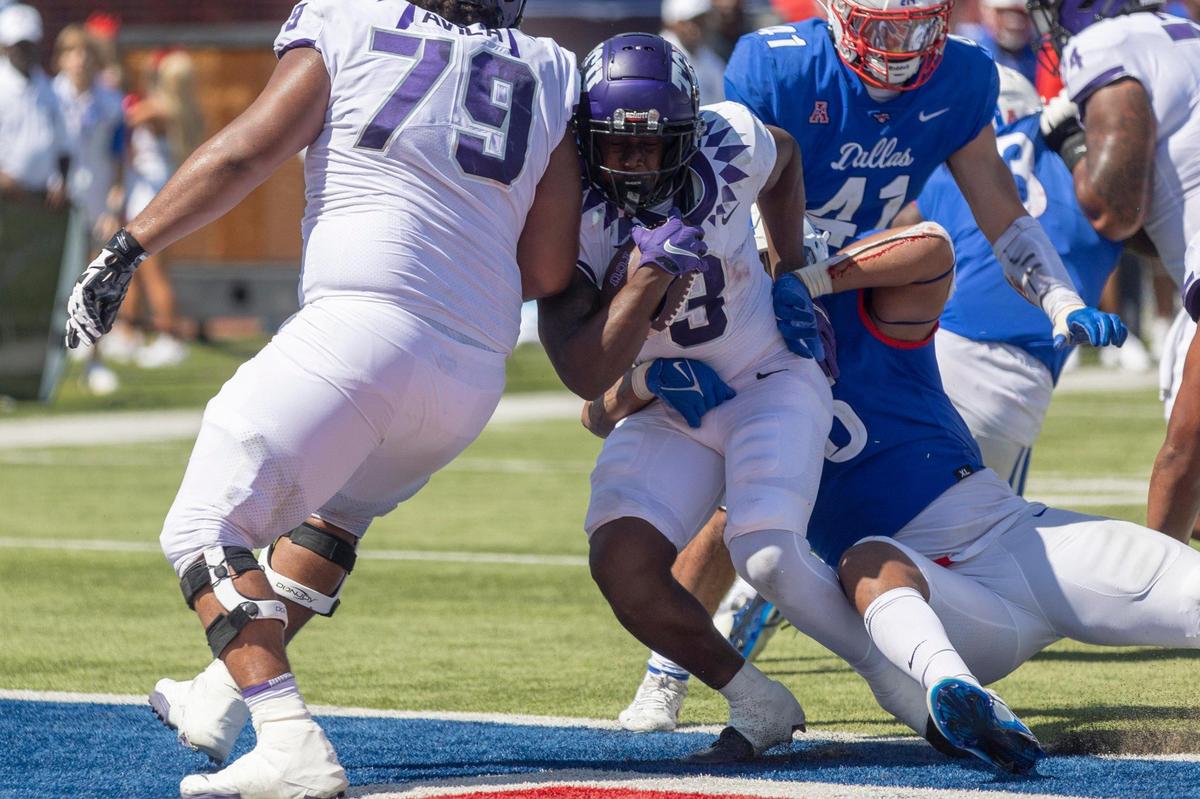 TCU running back Emari Demercado drives through the SMU defense to score a touchdown on Saturday, Sept. 24, 2022, at the Gerald Ford Stadium in the Southern Methodist University in Dallas, Texas.