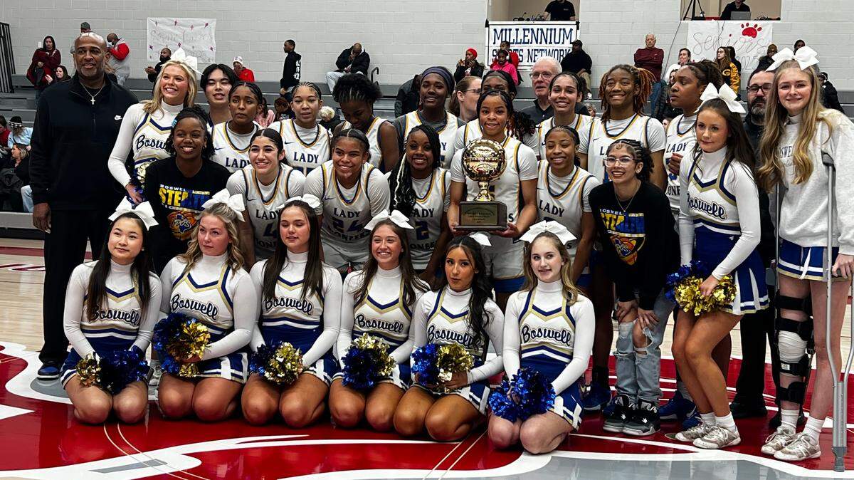 The Boswell girls basketball team poses for a team photo with the regional semifinal championship after a win over No. 6 Braswell at Ponder High School on Tuesday, Feb. 18, 2025.