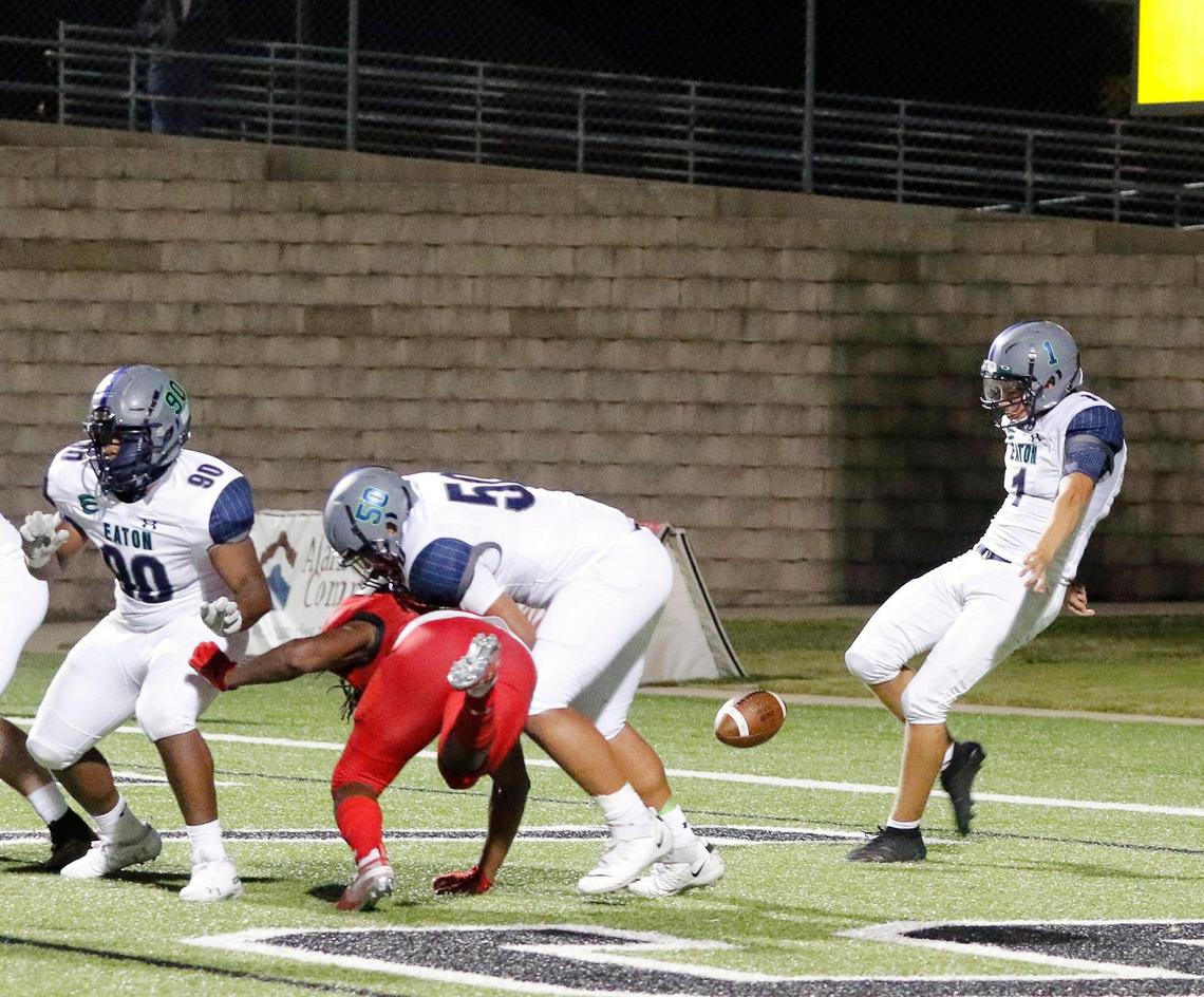 Eaton kicker Colby Sessums (1) punts out of his own end zone during a high school football game at Newsom Stadium in Mansfield, Texas, Thursday, Oct. 01, 2020. Eaton defeated Legacy 17-7. (Special to the Star-Telegram Bob Booth)