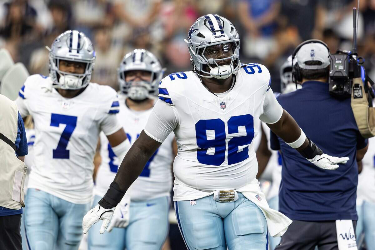 Cowboys defensive tackle Tommy Akingbesote (92) comes out of the tunnel prior to an NFL preseason game between the Dallas Cowboys and the Baltimore Ravens at AT&T Stadium in Arlington on Saturday, Aug. 16, 2025,