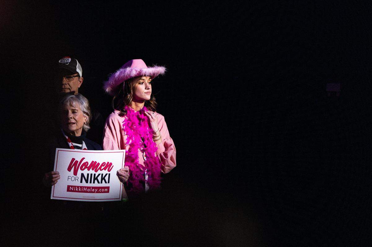 A volunteer dressed up in a pink cowboy hat remains on stage prior to Republican presidential candidate Nikki Haley’s rally at the Southside Music Hall in Dallas on Thursday, Feb. 15, 2024.