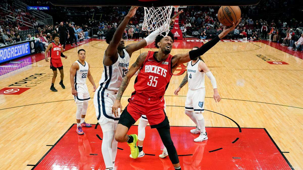 The Dallas Mavericks are acquiring Houston Rockets center Christian Wood in a trade that includes four Mavs players and the team’s upcoming No. 26 draft pick.