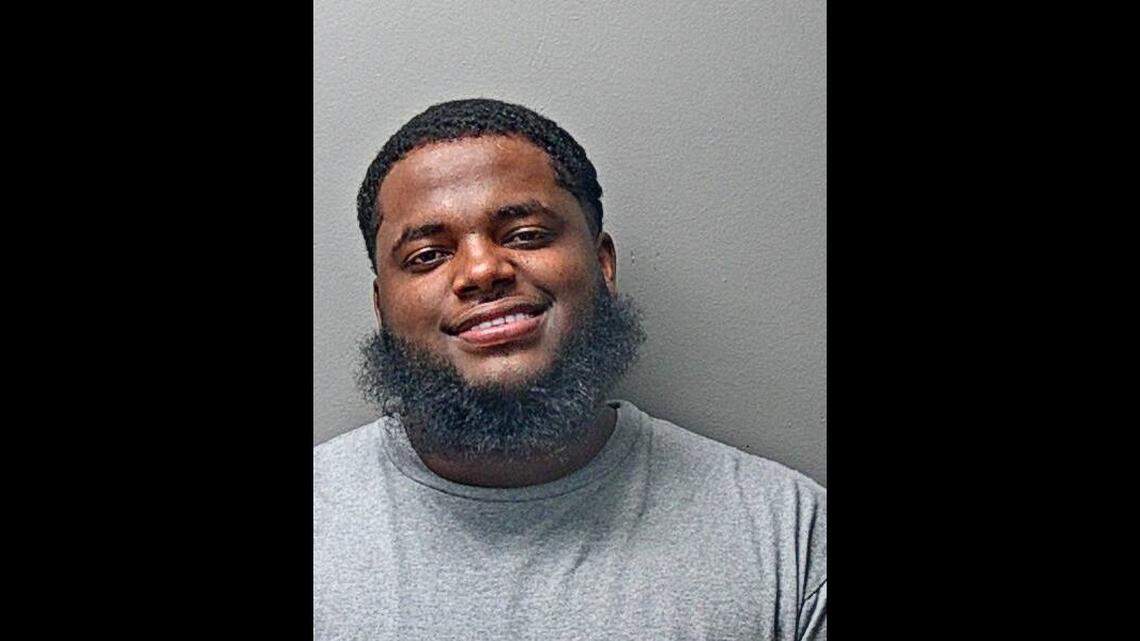 Cartaveion Holmon, 24, is accused of having targeted the elderly and vulnerable populations with deceptive sales tactics regarding solar panels and vehicle transactions.