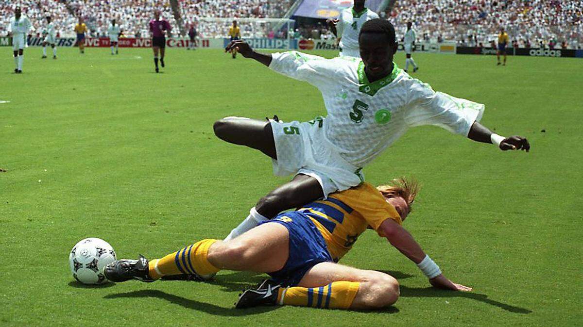 In this Star-Telegram file photo from July 3, 1994, Saudi defender Ahmed Jameel Madani tumbles over Sweden’s Kennet Andersson in a World Cup elimination match at the Cotton Bowl in Dallas, Texas.