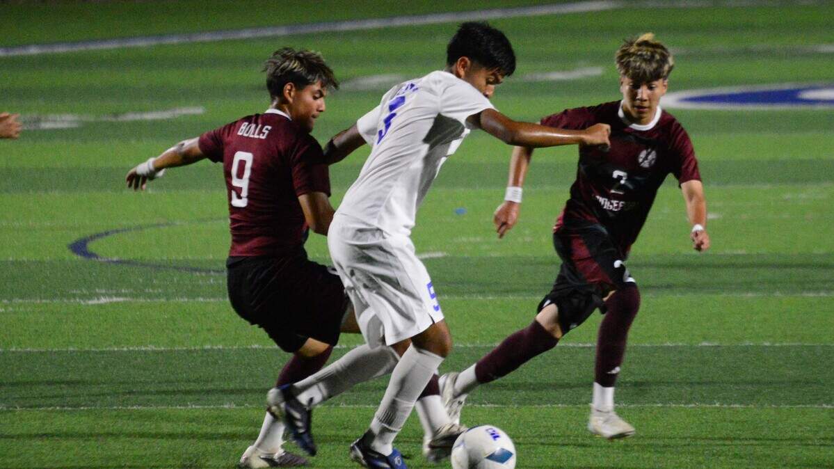 Bridgeport’s Jared Contreras (9) and Jesus Rodriguez (2) box in Brookshire Royal’s Juan Carlos Jimenez (5) in the boys UIL Class 4A Division II soccer state championship game on Thursday, April 9, 2026, at Birkelbach Field in Georgetown, Texas.
