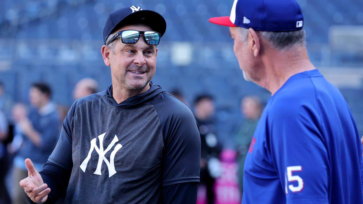 New York Yankees manager Aaron Boone (17) talks to Texas Rangers manager Bruce Bochy (15) before the start of their three-game series at Yankee Stadium on Tuesday, May 20. Bochy and the Rangers left the Bronx with three straight losses.