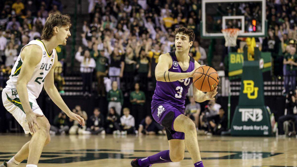 TCU guard Francisco Farabello (right) looks to pass as Baylor’s Matthew Mayer defends during a men’s college basketball game on Saturday at the Ferrell Center in Waco.