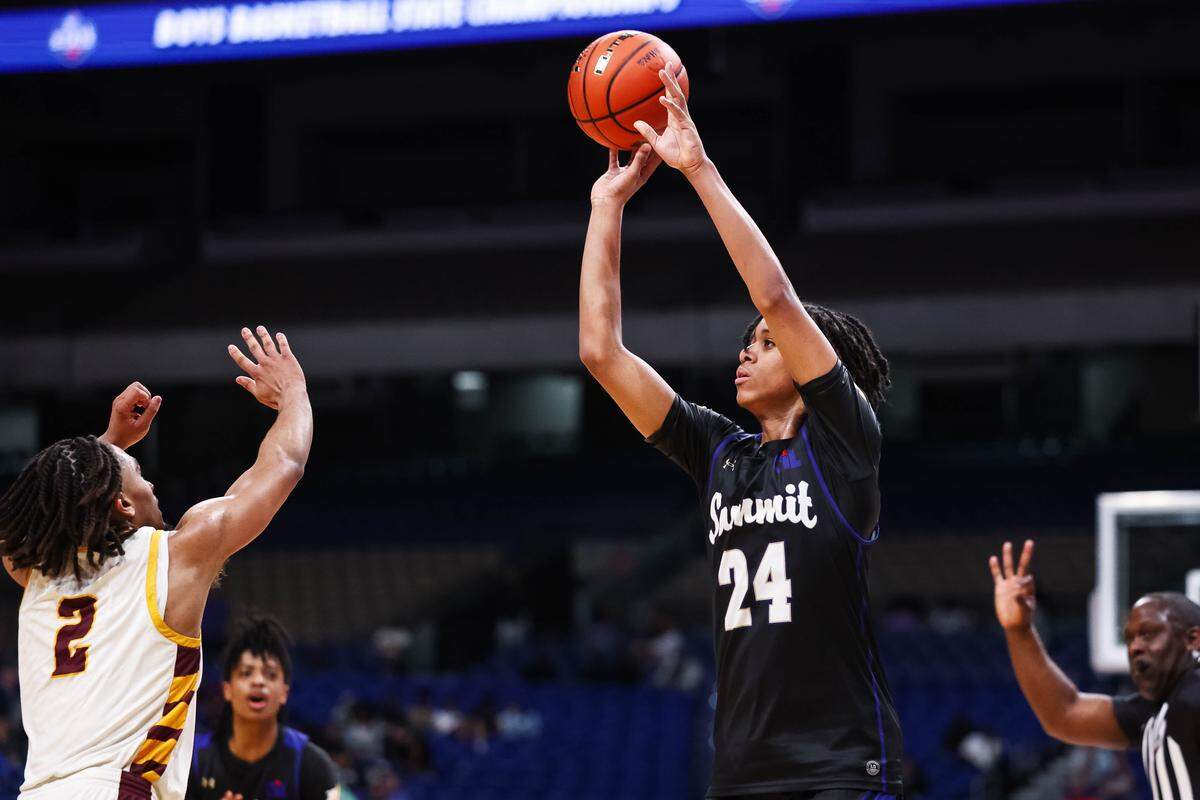 Mansfield Summit guard Joseph Creal III (24) attempts a 3-pointer over the hands of a Beaumont United defender during the Class 5A Division II state championship game Saturday at the Alamodome in San Antonio.
