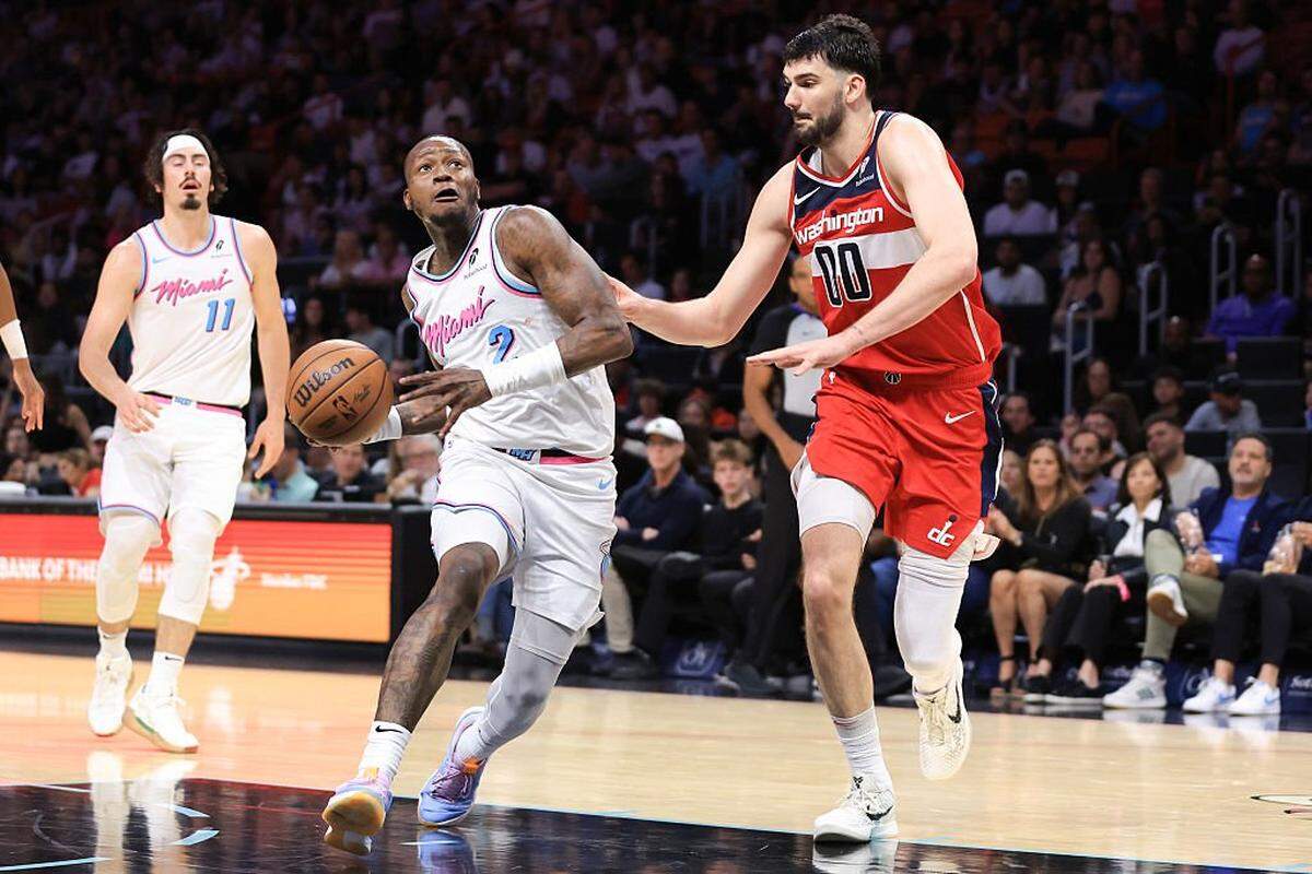 MIAMI, FLORIDA - APRIL 13: Terry Rozier #2 of the Miami Heat drives against Tristan Vukcevic #00 of the Washington Wizards during the fourth quarter of the game at Kaseya Center on April 13, 2025 in Miami, Florida. NOTE TO USER: User expressly acknowledges and agrees that, by downloading and or using this photograph, User is consenting to the terms and conditions of the Getty Images License Agreement. (Photo by Megan Briggs/Getty Images)
