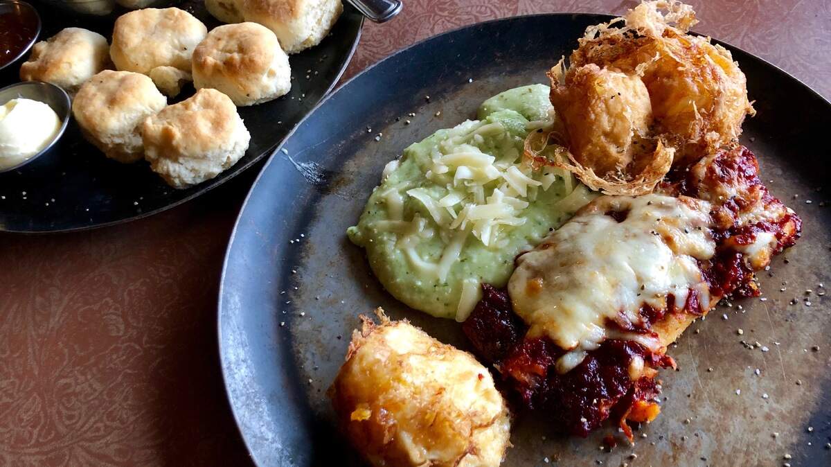 Deep-fried eggs with enchiladas, green chile grits and mini-biscuits at Horseshoe Hill Cafe. Bud Kennedy bud@star-telegram.com