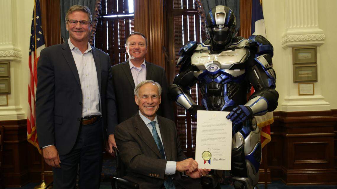 FOX Sports Southwest SVP/General Manager Steve Simpson, UIL Deputy Director Dr. Jamey Harrison, Cleatus the FOX Sports Robot and Texas Governor Greg Abbott at the Texas State Capitol in Austin after the governor signed a proclamation declaring Aug. 31 – Sept. 1, 2018, to be Texas Football Days in the Lone Star State.