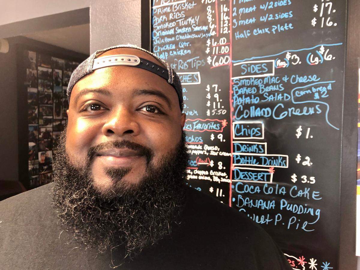 Pitmaster Derrick Walker of Smoke-A-Holics BBQ has waiting lines for his brisket, pork ribs and soul-food sides.