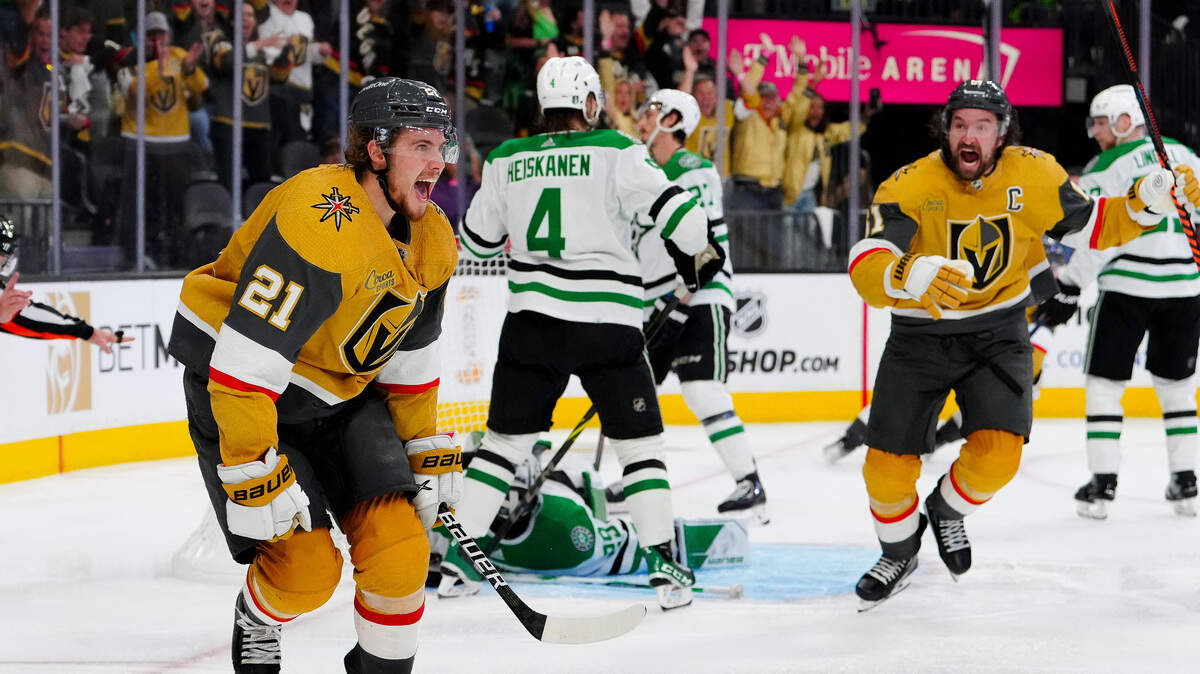 Vegas Golden Knights center Brett Howden (21) and right wing Mark Stone (61) celebrates after Howden scores the game winning goal against Dallas Stars goaltender Jake Oettinger (29) during the overtime period in game one of the Western Conference Finals of the 2023 Stanley Cup Playoffs at T-Mobile Arena. Mandatory.