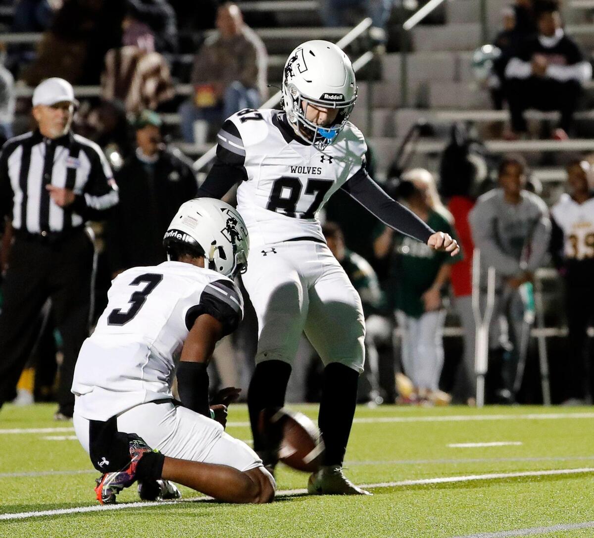 Timberview kicker Emma Young (87) adds in a PAT in the first half of a UIL Class 5A D1 Region 2 final football game at Mesquite Memorial in Mesquite, Texas, Friday, Dec. 02, 2022.