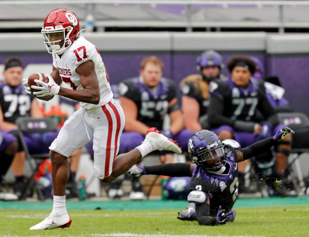 TCU corner back Kee’Yon Stewart (2) watches as OU wide receiver Marvin Mims (17) runs past for a touchdown in the second half of a NCAA football game at Amon G. Carter Stadium in Fort Worth Texas, Saturday, Oct. 24, 2020. OU defeated TCU 33-14. (Special to the Star-Telegram Bob Booth)