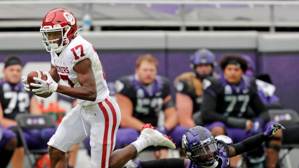 TCU corner back Kee’Yon Stewart (2) watches as Oklahoma wide receiver Marvin Mims (17) run for a touchdown in 2020. Mims is one of several strong offensive players returning for the Sooners.