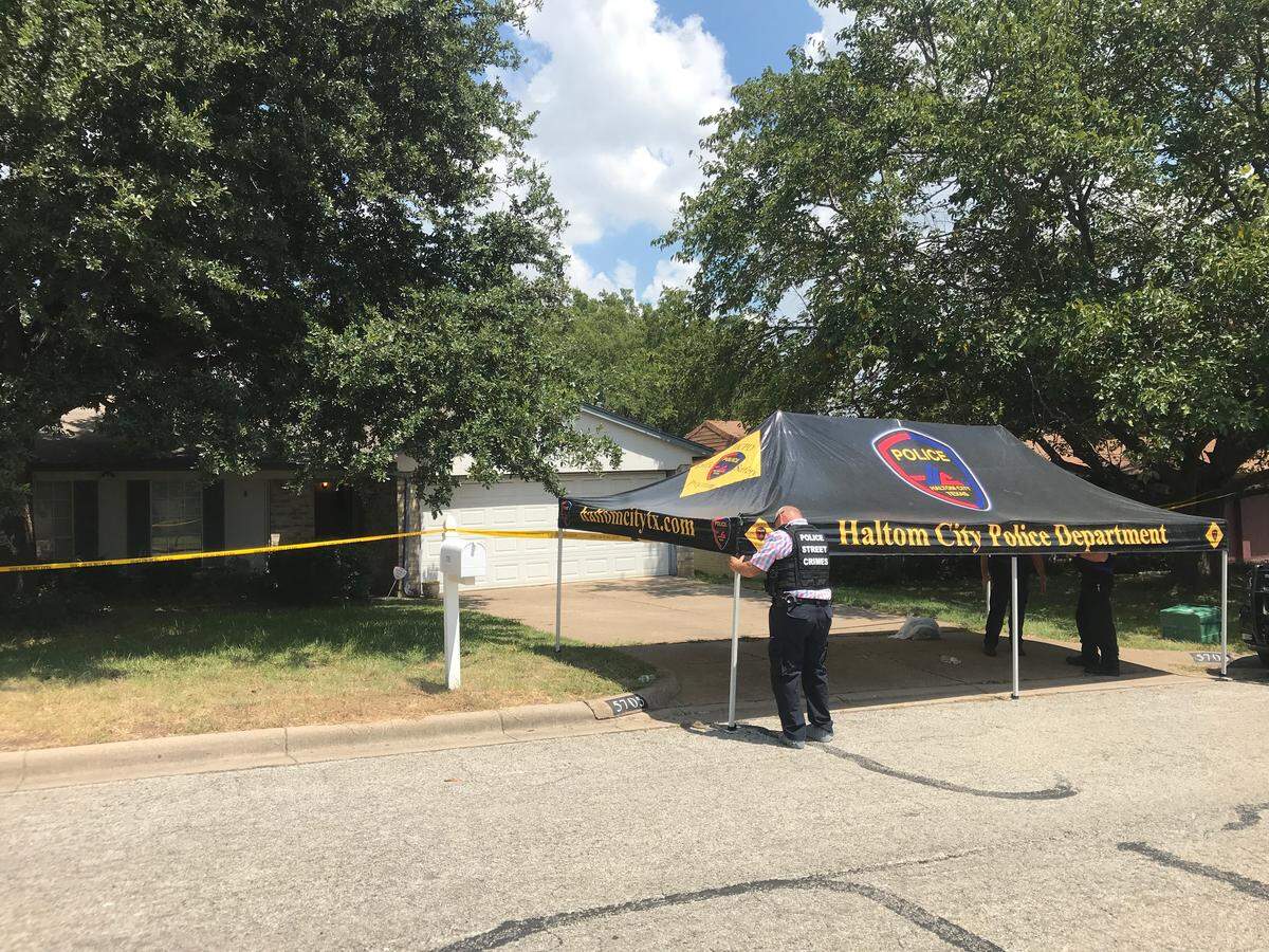Haltom City police officers clear the scene of a home in the 5700 block of Macneill Drive where a woman’s body was found with stab wounds early Thursday morning, police said. The woman was identified by police on Thursday afternoon as Dena Conditt Wright, and her twin brother, David Conditt, is wanted on a murder charge in connection with her death.