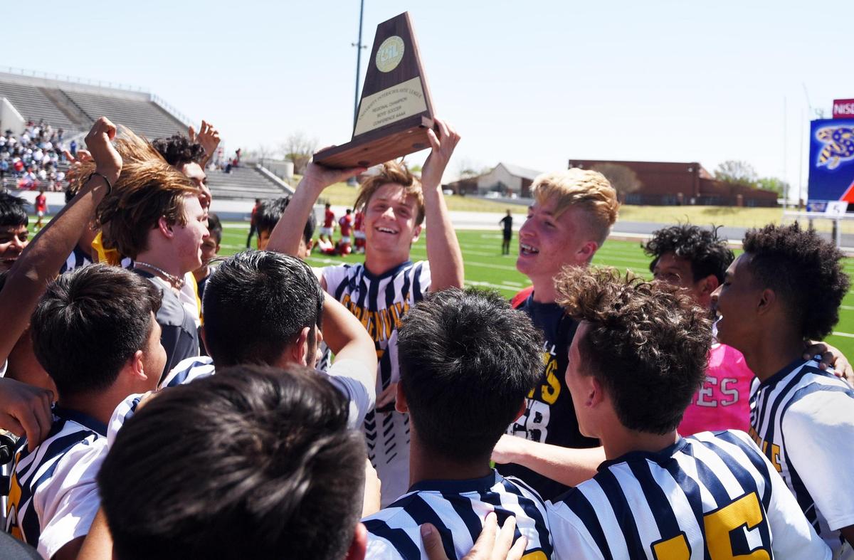 Stephenville’s Parker Plaxco, center celebrates with teammates as he lifts the championship trophy after they defeated Castleberry 5-2 in the Region 1-4A boys soccer final Saturday, April 9, 2022 at Northwest ISD Stadium in Justin Texas. Special/Bob Haynes
