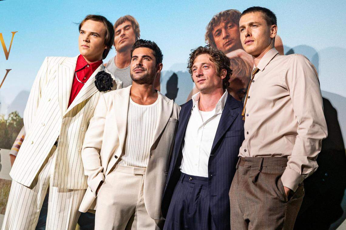 Actors Stanley Simons, Zac Efron, Jeremy Allen White and Harris Dickinson, who star together as the Von Erich brothers, pose for photos on the red carpet for the world premiere of the movie “The Iron Claw,” at the Texas Theater in Dallas on Wednesday, Nov. 8, 2023.