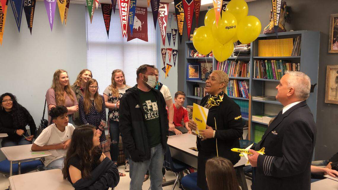 Fossil Ridge coach Adam Webb being surprised with a trip to Boston from members of Spirit Airlines.