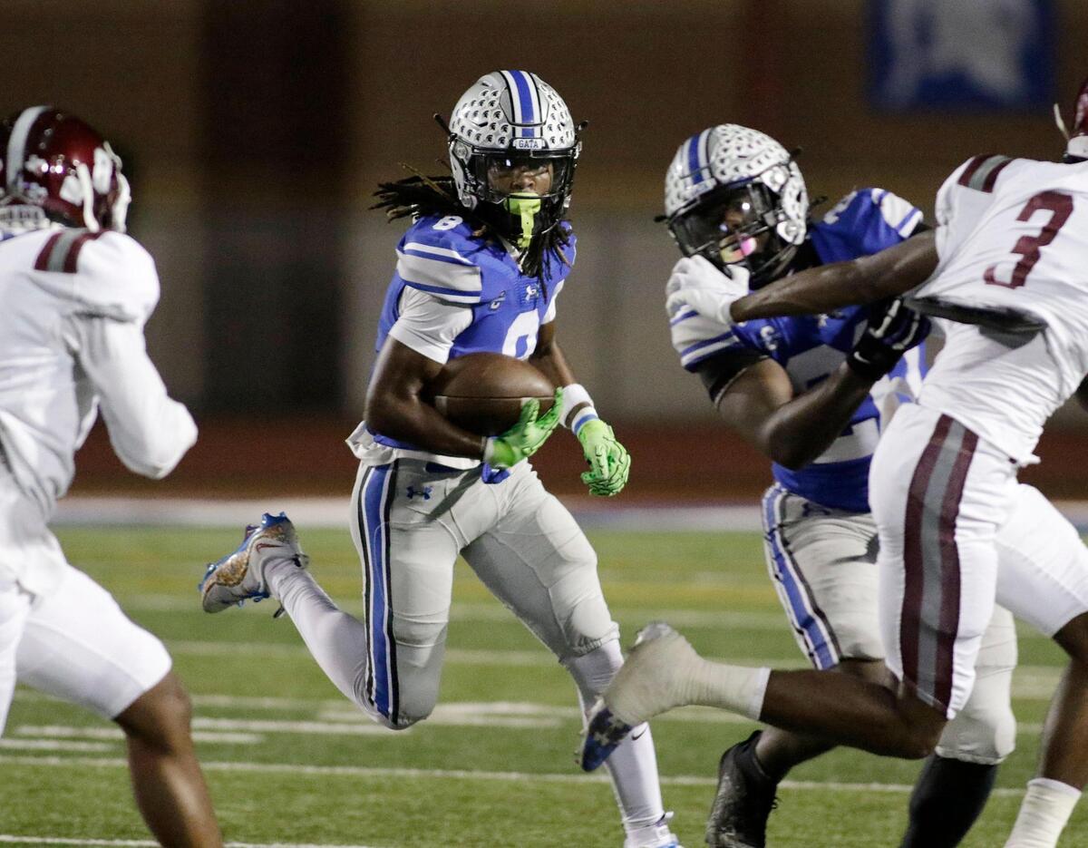 Burleson’s Keilan Gregory looks for a seam in the Red Oak defense during a UIL football game at Burleson ISD Stadium on Friday October 25, 2024.