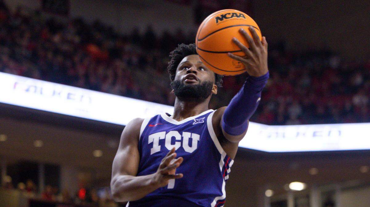 TCU’s Mike Miles Jr. (1) shoots during the first half of an NCAA college basketball game against Texas Tech, Saturday, Feb. 25, 2023, in Lubbock, Texas. (AP Photo/Chase Seabolt)