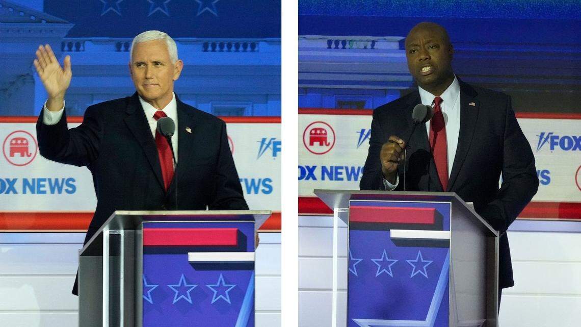 Former Vice President Mike Pence (left) and South Carolina Sen. Tim Scott at the Republican presidential debate Wednesday in Milwaukee.