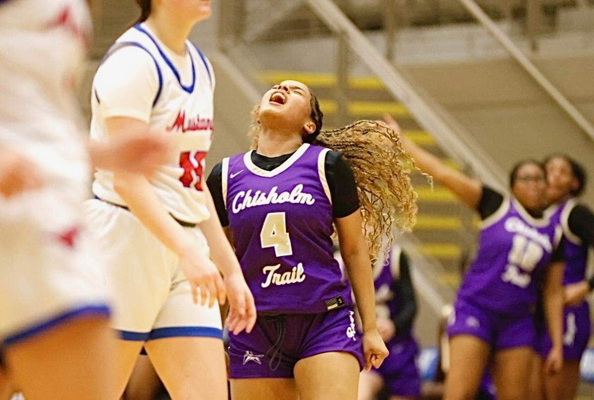 Fort Worth Chisholm Trail’s Jayci Butler reacts after making a three pointer at the halftime buzzer against Grapevine in a UIL girls Class 5A Division II bi-district game on Monday, February 16, 2026 at Thomas Coliseum in Haltom City, Texas. Grapevine defeated Chisholm Trail 56-47.