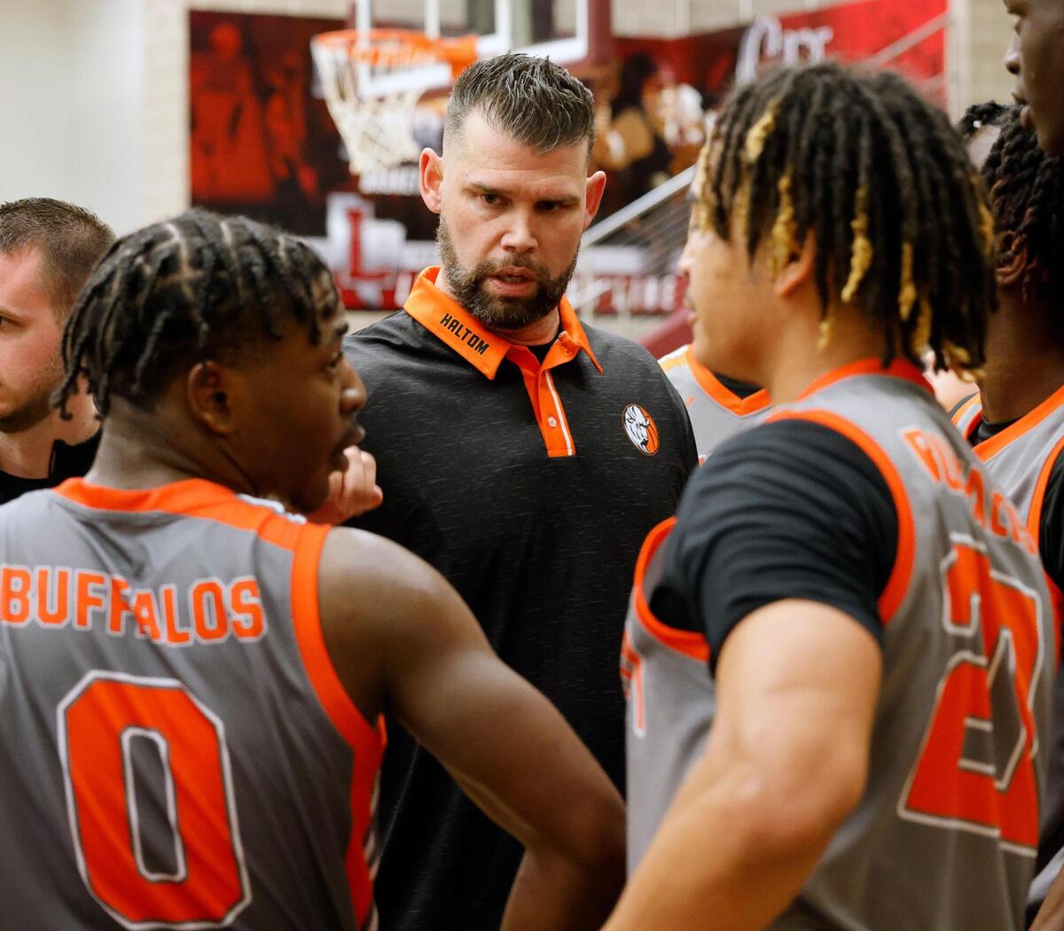 Haltom head coach Tyler Hatch talks to the team in the fourth period of a UIL Conference 6A Division 1 boys bi-district basketball playoff game at Lewisville High School in Lewisville, Texas, Tuesday, Feb. 20, 2024.