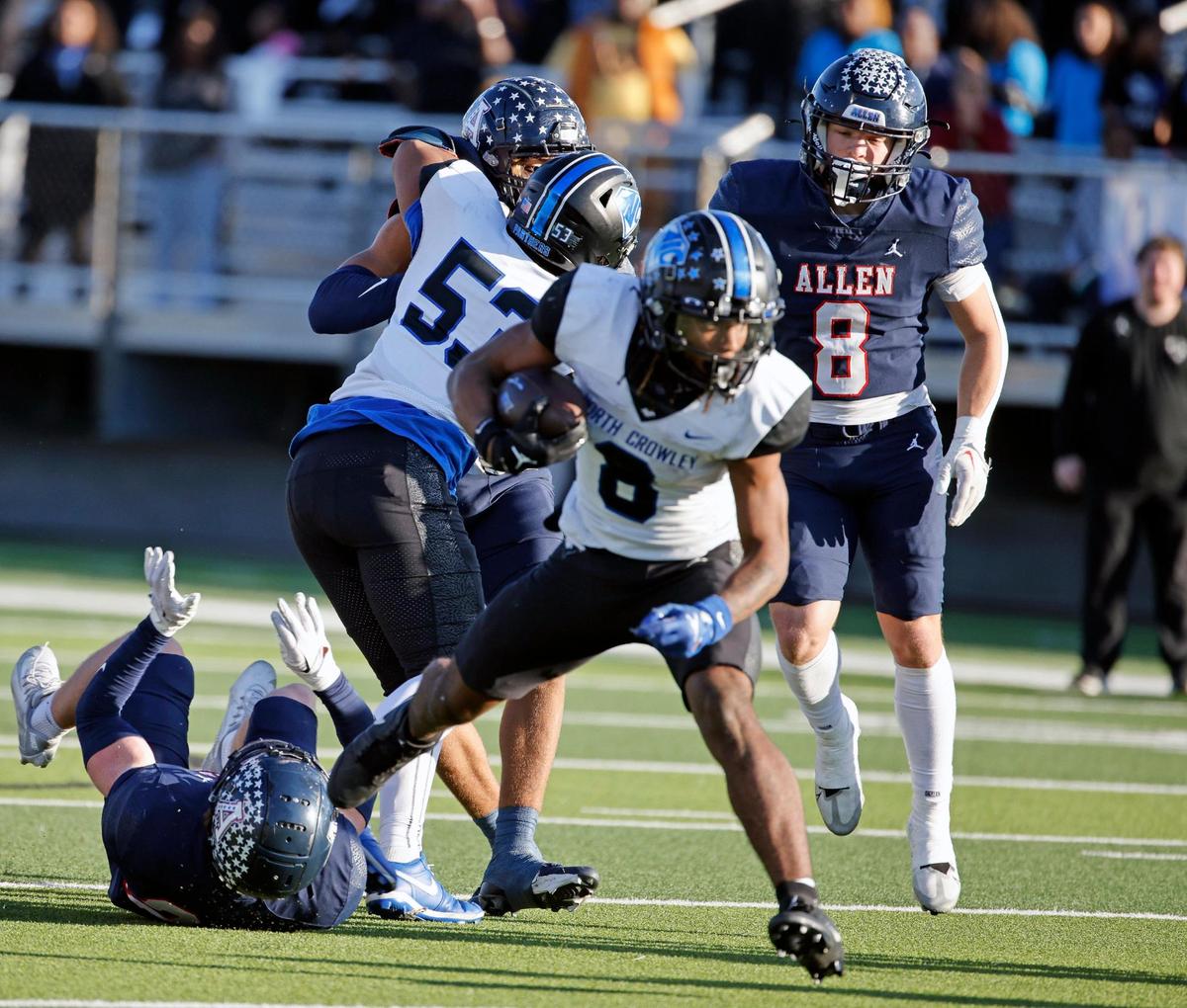 North Crowley running back Ashton Searl (8) looks for open field during the second half of a UIL Conference 6A Division 1 quarterfinal football playoff game at Dragon Stadium in Southlake, Texas, Saturday, Dec. 02, 2023.