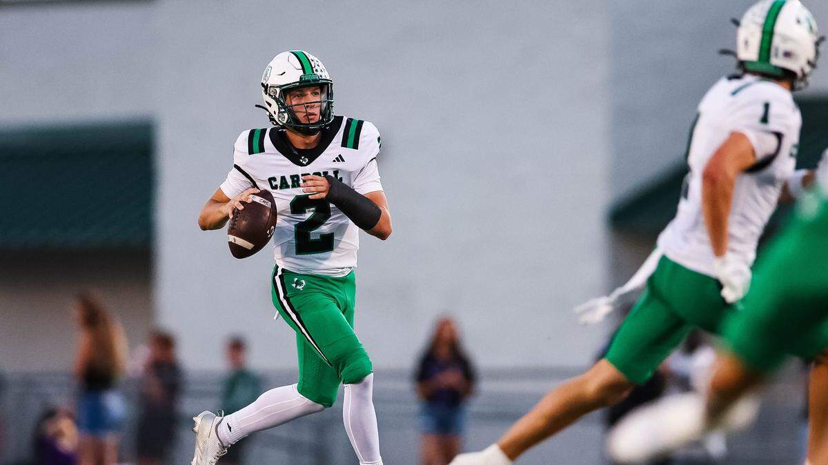 Southlake Carroll quarterback Angelo Renda runs with the football looking downfield to a wide receiver in a district matchup against Keller Timber Creek at Keller ISD Stadium on Thursday Sept. 25, 2025.