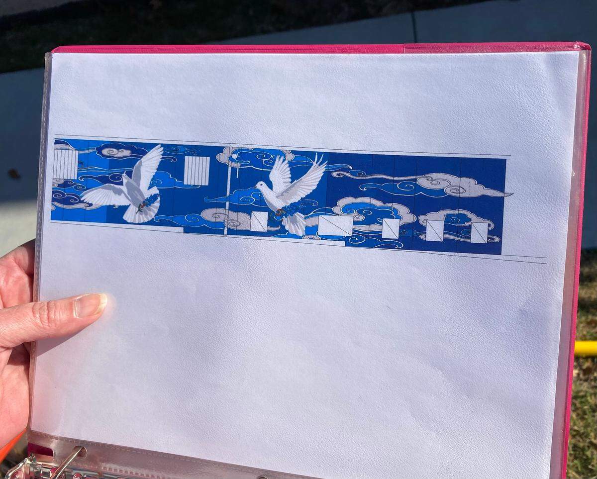 Anne Allen’s plan for her downtown mural. Allen began painting the primer for her project Saturday morning. She hopes to have her mural done by Thanksgiving weekend.
