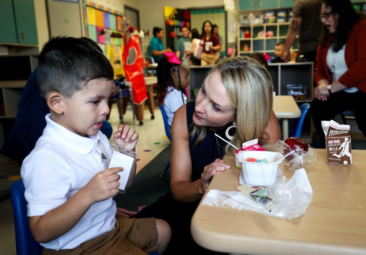 Fort Worth Mayor Mattie Parker talks with pre-kindergarten student Mateo during the first day of school at T.A. Sims Elementary School on Monday, August 14, 2023, in Fort Worth.
