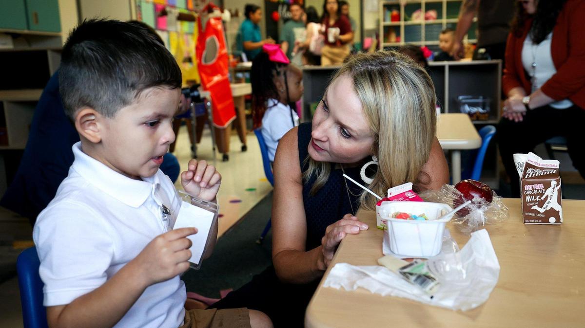 Fort Worth Mayor Mattie Parker talks with pre-kindergarten student Mateo during the first day of school at T.A. Sims Elementary School on Aug. 14, 2023.