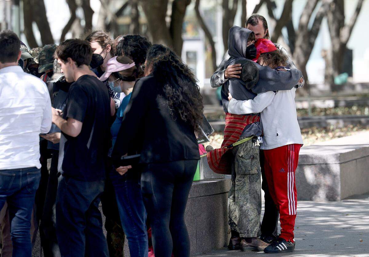 Supporters of the nine defendants indicted in connection to the nonfatal shooting of a police officer outside the Prairieland ICE Detention Center hug after the verdict was announced on Friday, March 13, 2026, outside the U.S. District Court in Fort Worth. It was a mixed verdict with Benjamin Song, the shooter, found guilty of attempted murder of a police officer and eight defendants guilty on charges of rioting, providing material support to terrorists, and using explosives.