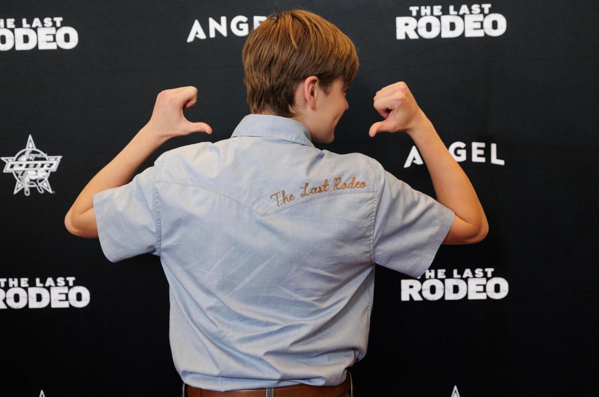 Actor Graham Harvey shows off the embroidery on his shirt during the world premiere of “The Last Rodeo” at AMC Dine-In Clearfork on Monday, May 12, 2025, in Fort Worth.