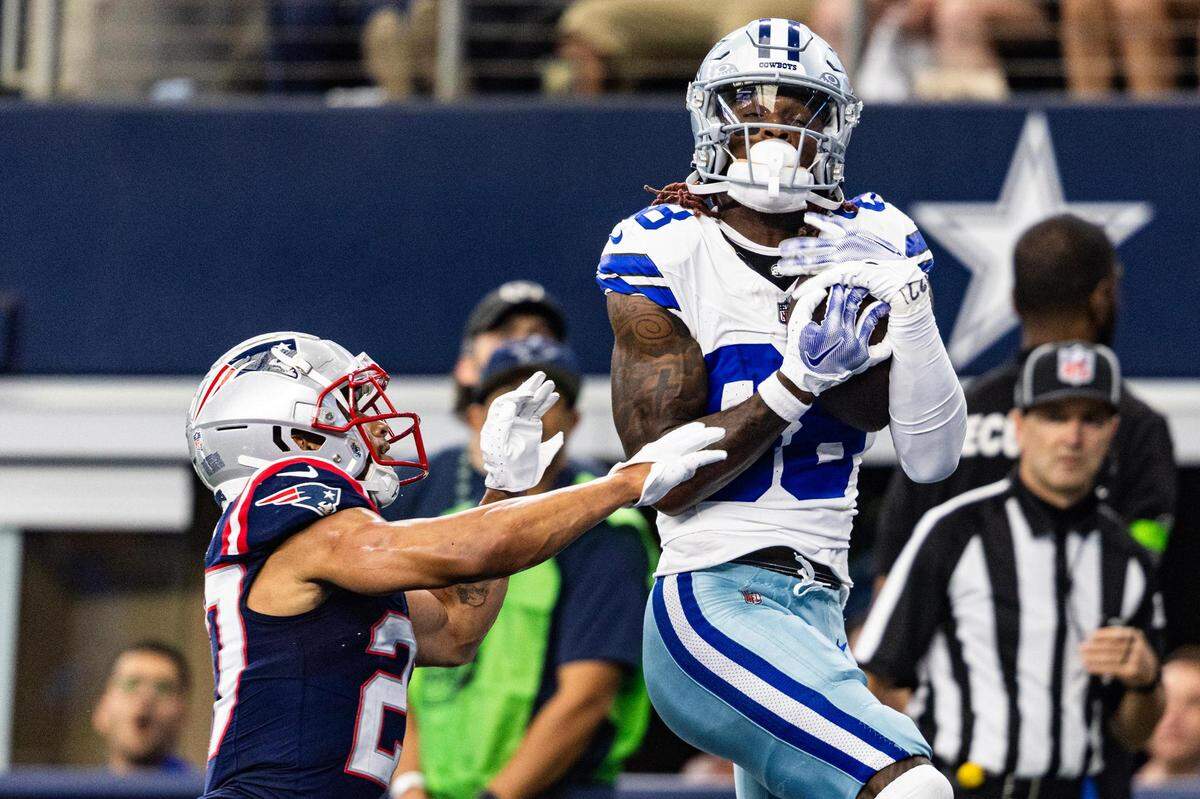 Cowboys wide receiver CeeDee Lamb (88) catches a touchdown in the first half of an NFL game between the Dallas Cowboys and New England Patriots at AT&T Stadium in Arlington on Sunday, Oct. 1, 2023.