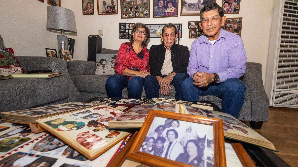 Diana Garcia Rios, her cousin Guadalupe Guajardo (center) and her husband Juan Rios Jr., are photographed while looking through their family photos and photo books at Rios’ home on Fort Worth’s north side. Rios said she has had five generations of family who have resided on Fort Worth’s north side.