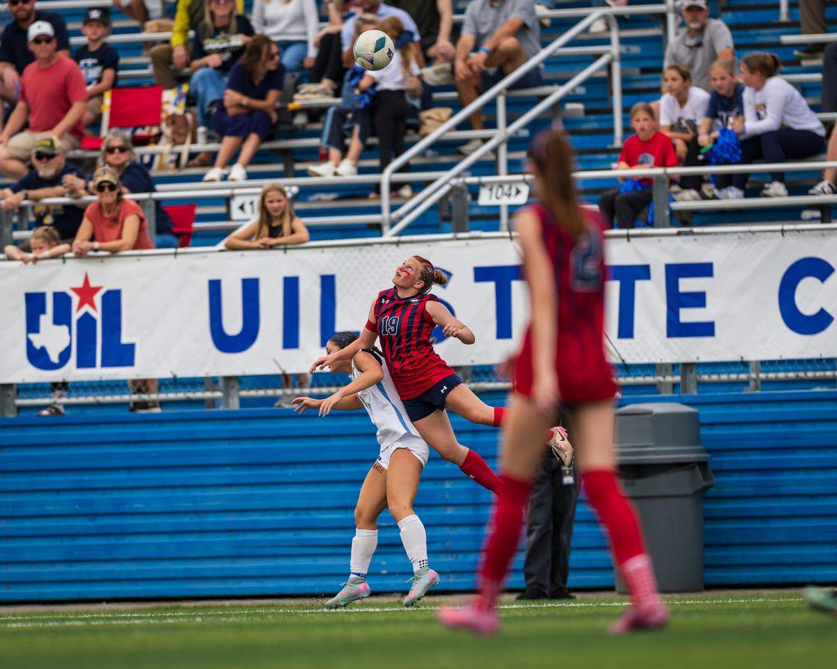 Grapevine’s Makena Kerr battles for the ball with a Montgomery Lake Creek player in the UIL Class 5A Division II state soccer championship game on Friday, April 10, 2026, at Birkelbach Field in Georgetown, Texas.