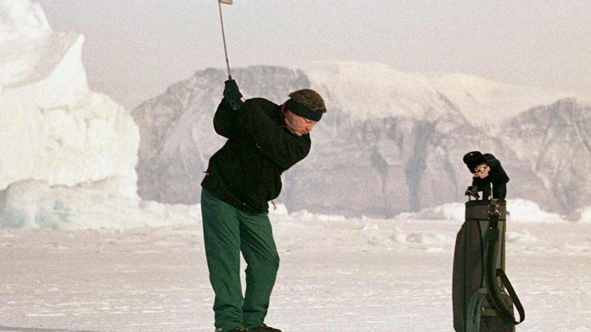 A player tees off during practice day at the first World Ice Golf Championships in Uummannaq, Greenland, March 26, 1999.