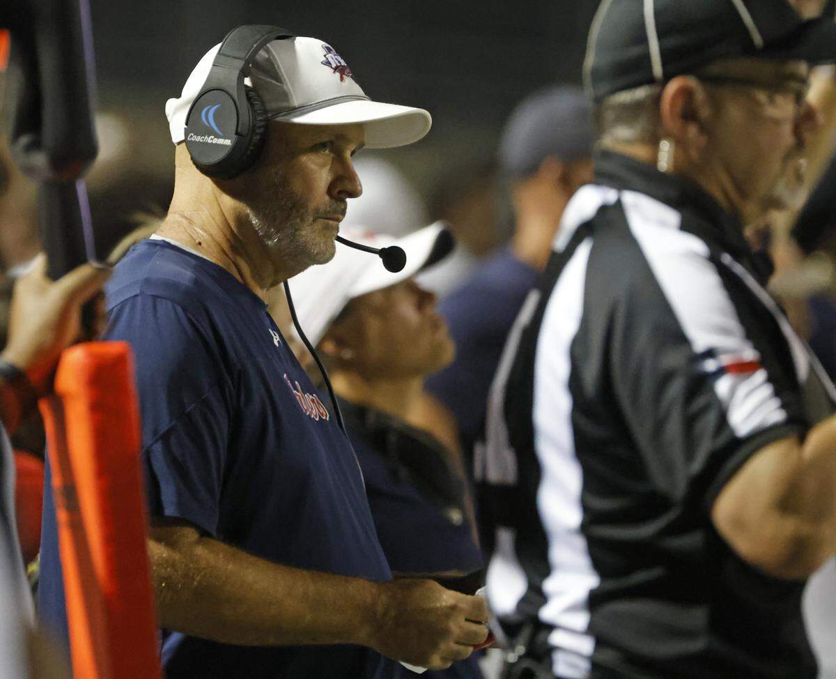 Ryan head coach Dave Henigan watches offensive action during the second half of a UIL football game at Vernon Newsom Stadium in Mansfield, Texas, Thursday, Sept. 04, 2025.