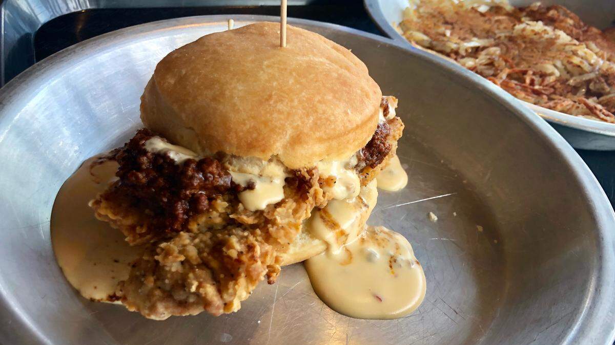 Chicken-fried steak on a biscuit with chili and queso at Ben’s Triple B.