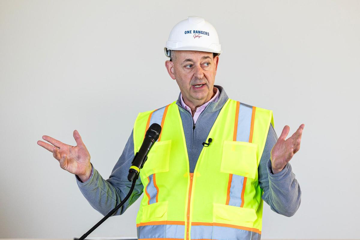 The Texas Rangers Executive Vice President of Business Operations Rob Matwick speaks to the media gathered for a hard hat tour of the One Rangers Way residential apartment complex in the Arlington Entertainment District on Tuesday, Nov. 12, 2024.