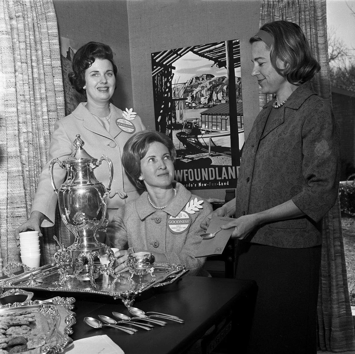 From left are Mrs. C. W. Stumhoffer, Mrs. Killough K. Smith Jr., and Mrs. Thomas B. Romine Jr., attending a coffee at the home of Mrs. Frank Carvey Jr. to raise funds for the Community Arts Fund in 1964.
