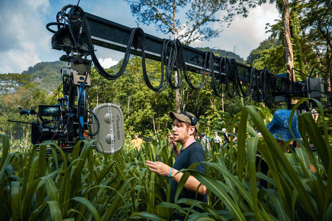 Director Gareth Edwards (center) on the set of “Jurassic World Rebirth.”