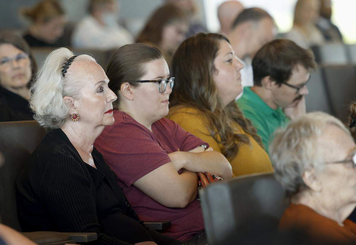 Sue Weston and her supporters attend a Fort Worth City Council meeting addressing the rezoning of 119 acres of property owned by Black Mountain Power for light industrial use on Tuesday, Sept. 30, 2025. Weston opposed the rezoning due to concerns of the proximity of the land to her botanical garden, Weston Gardens.