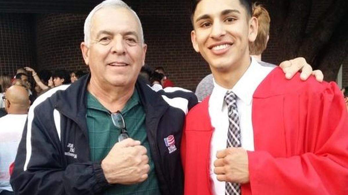 Joe Ponce, who trained hundreds of inner-city youth in boxing, celebrates with one of his boxers, Brandon Rivas, as he graduates from Castleberry High School in 2018.