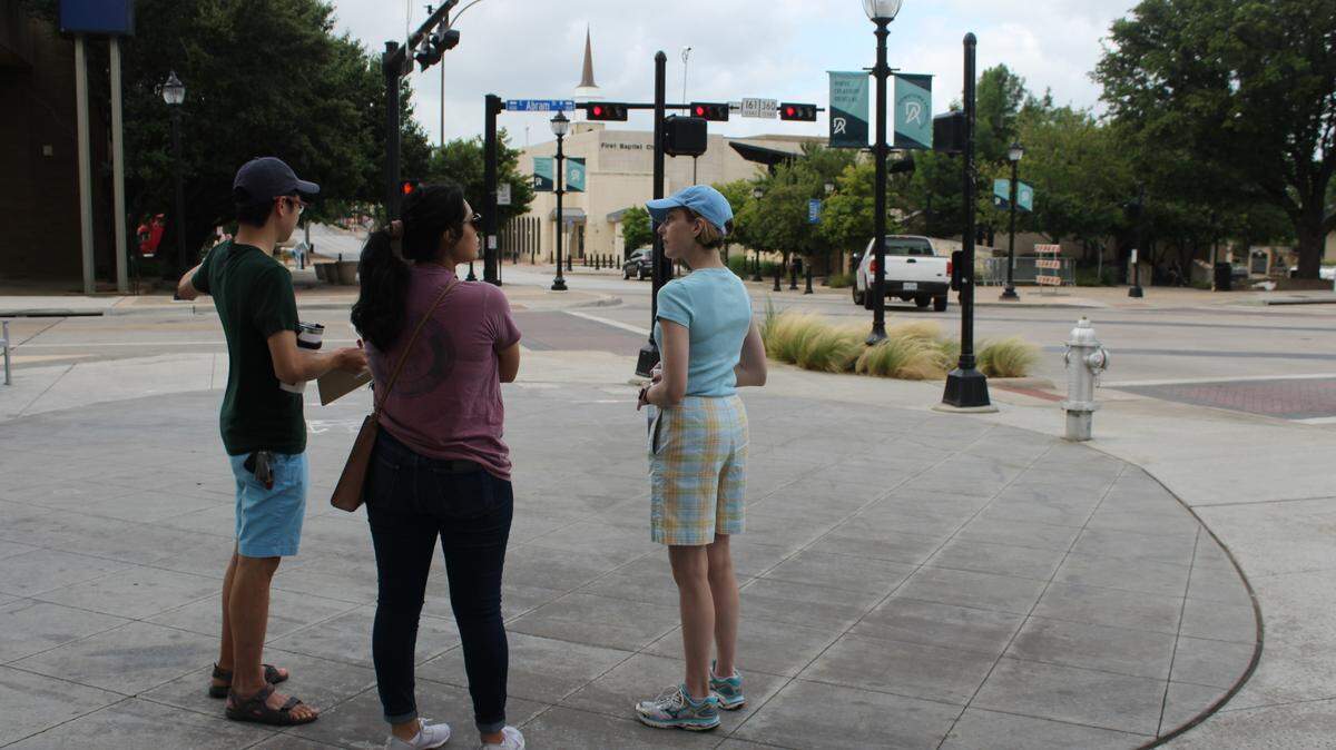 Members of Walkable Arlington discuss the Center and Abram Street intersection with Victoria Farrar-Myers, District 7 city council member, right. The trio was part of an audit of downtown safety conditions and motorist behavior in June.