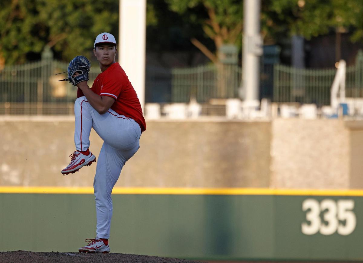 Grapevine pitcher Benjamin Chen (18) winds up for a pitch during a UIL 5A D2 semifinal baseball game at Riders Park in Frisco, Texas, Friday, May 30, 2025.